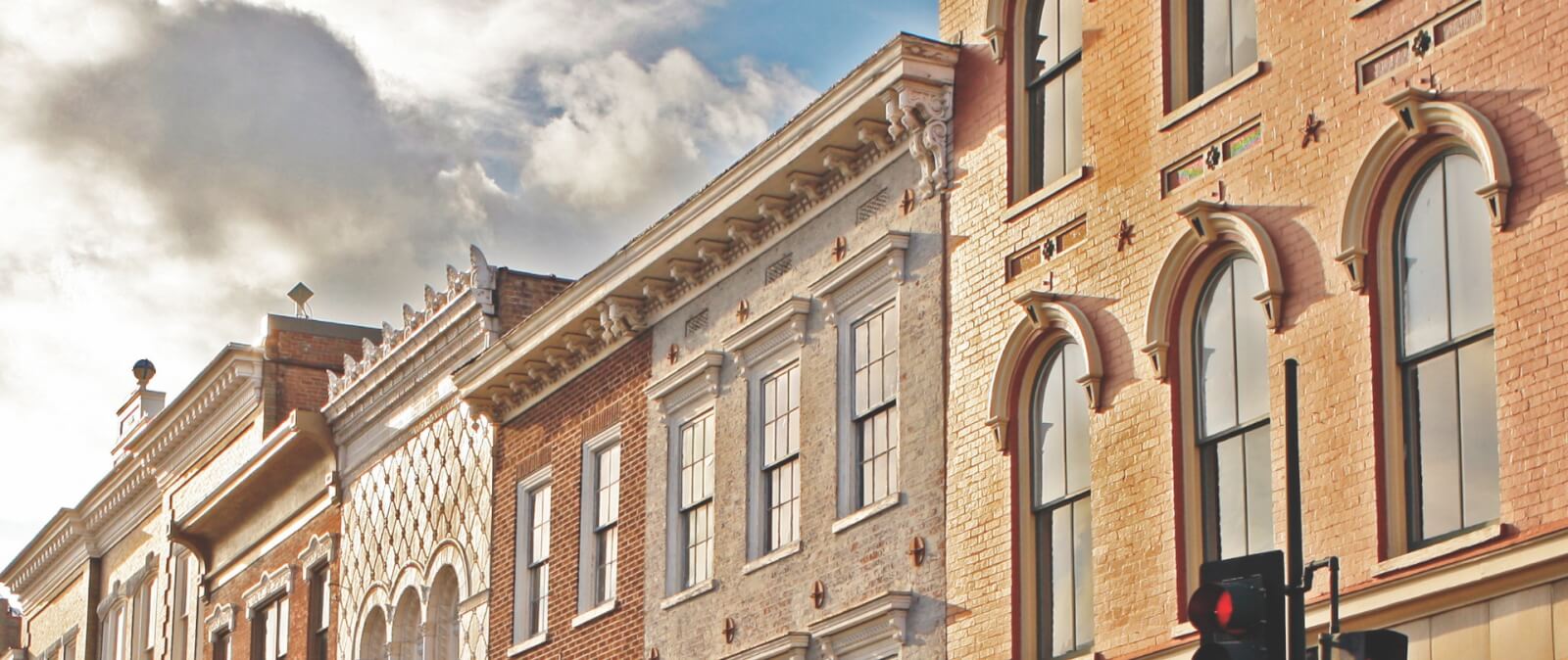 Brick facades of historical buildings in downtown staunton virginia line the street.